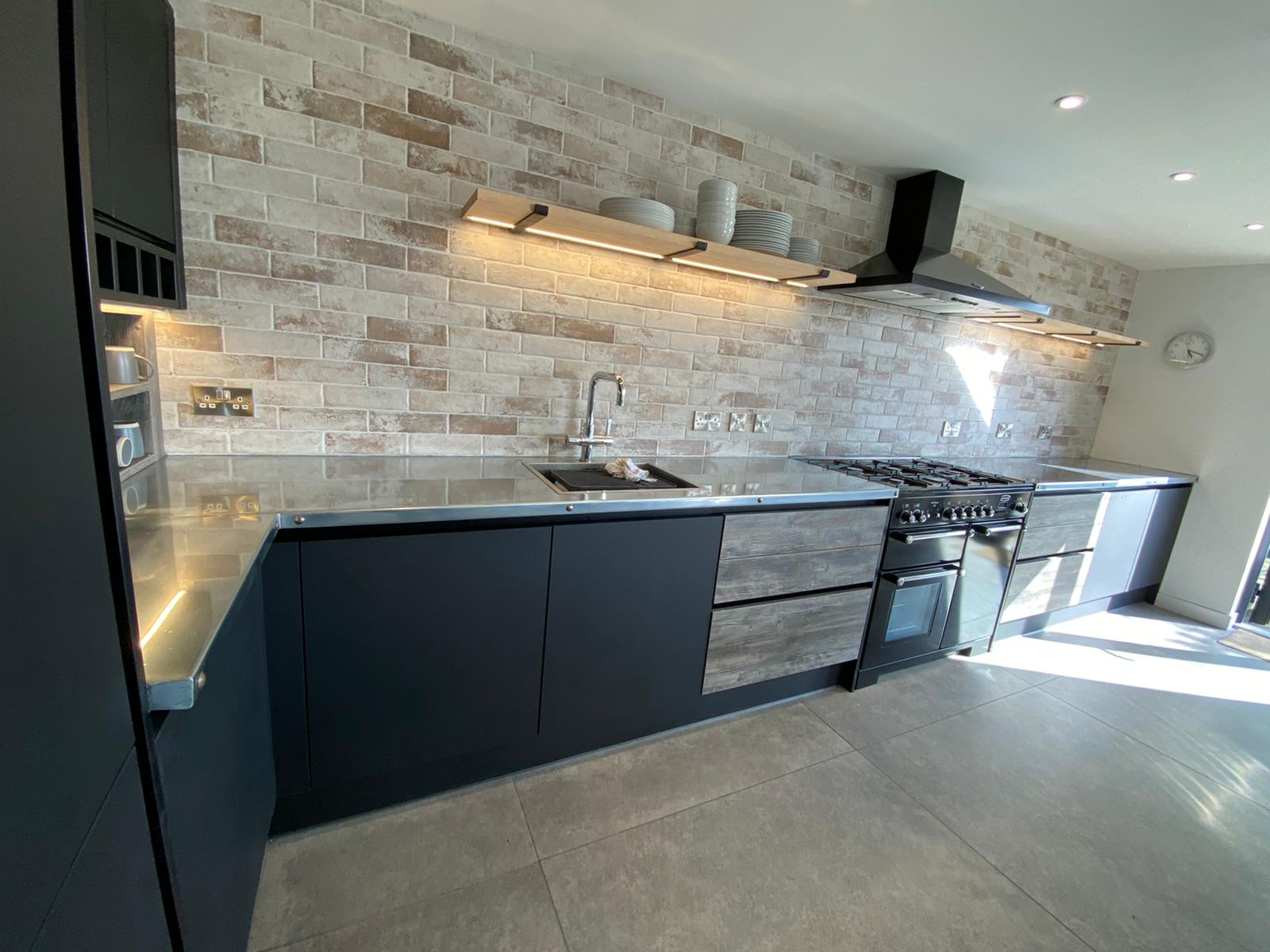 A kitchen with an aluminium finish on the counter tops
